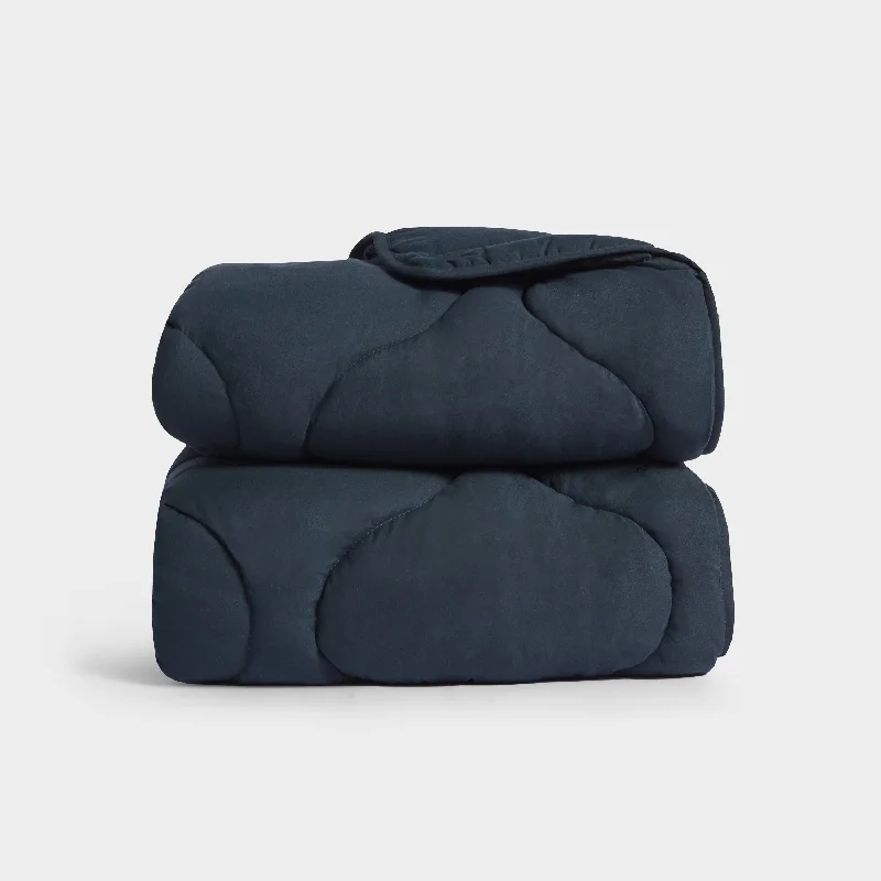 modern floral pillowcase-Quilted Snuggle Blanket in Navy